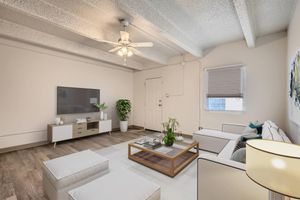 a living room with a sink and a mirror