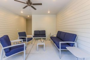 a living room filled with furniture and a table