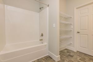 a room with a sink and a shower