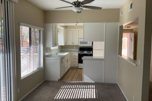 a kitchen with a sink and a mirror