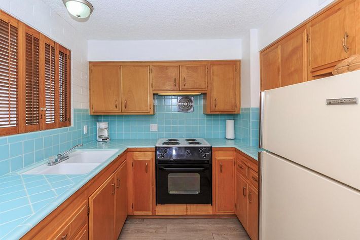 a kitchen with a stove top oven