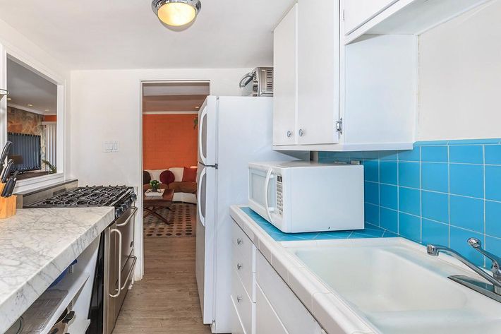 a kitchen with a stove and a sink