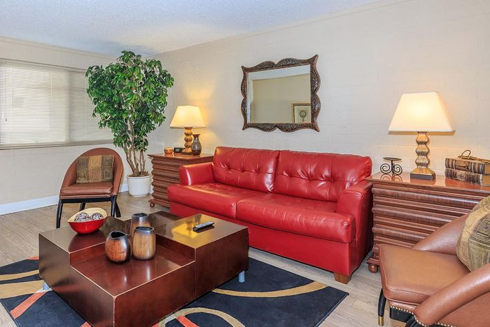 a living room filled with furniture and a fire place