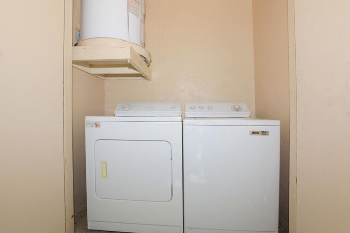 a white refrigerator freezer sitting inside of a kitchen