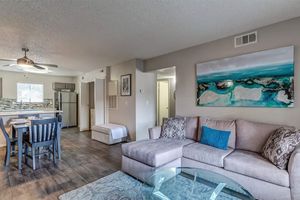 a living room filled with furniture and a table