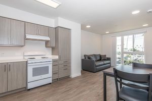 a kitchen filled with lots of furniture