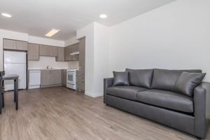 a living room with a wooden floor