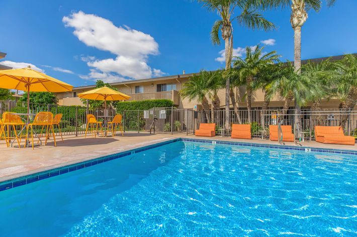 Vio Tustin community pool with yellow umbrellas