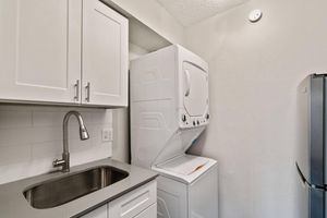 a kitchen with a sink and a microwave