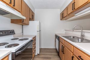 a kitchen with a stove top oven