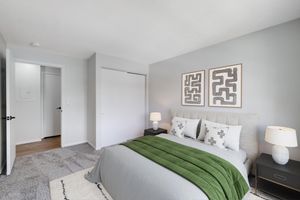 a bedroom with a large bed in a hotel room