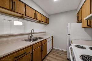 a kitchen with a stove and a sink