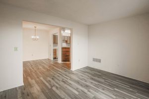 a large empty room with a wood floor