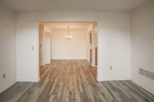 a large empty room with a wood floor