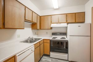 a kitchen with a stove top oven sitting inside of a refrigerator