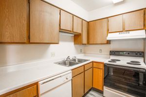 a kitchen with a stove top oven