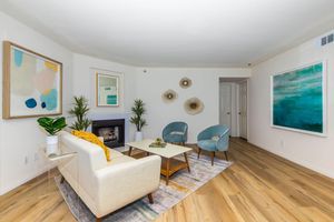 a living room filled with furniture and a flat screen tv