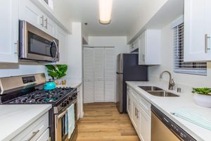 a kitchen with a sink and a window