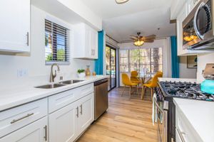 a kitchen with an island in the middle of a room