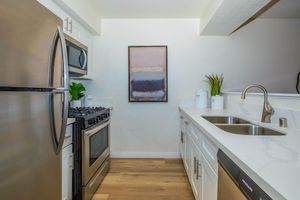 a kitchen with a sink and a window