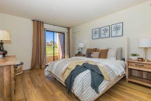 a bedroom with a large bed in a room