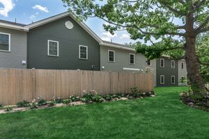 a house with trees in the front yard