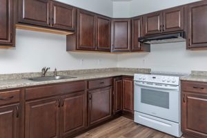 a kitchen with stainless steel appliances and wooden cabinets