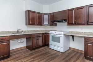 a kitchen with stainless steel appliances and wooden cabinets