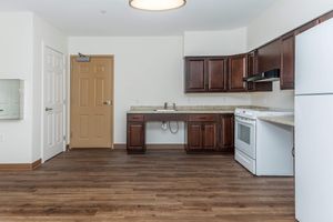 a kitchen with a stove and a refrigerator