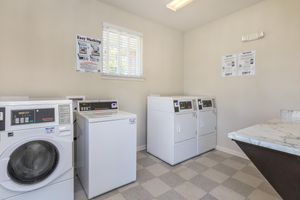 a white refrigerator freezer sitting inside of a kitchen