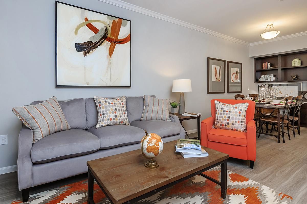 a living room filled with furniture and a fire place