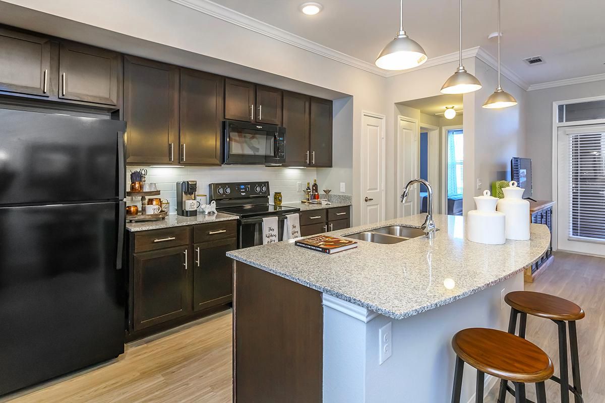 a modern kitchen with stainless steel appliances