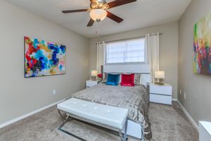 a bedroom with a bed in a room
