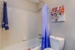 a shower that has a sink and a mirror