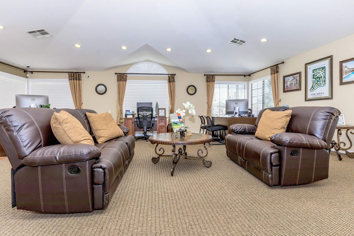 a living room filled with furniture and a tv