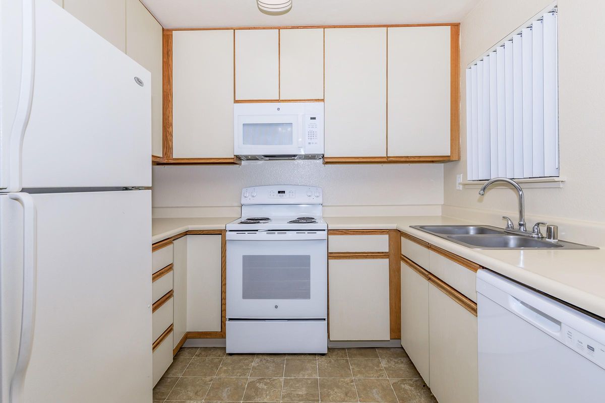 a kitchen with a sink and a microwave