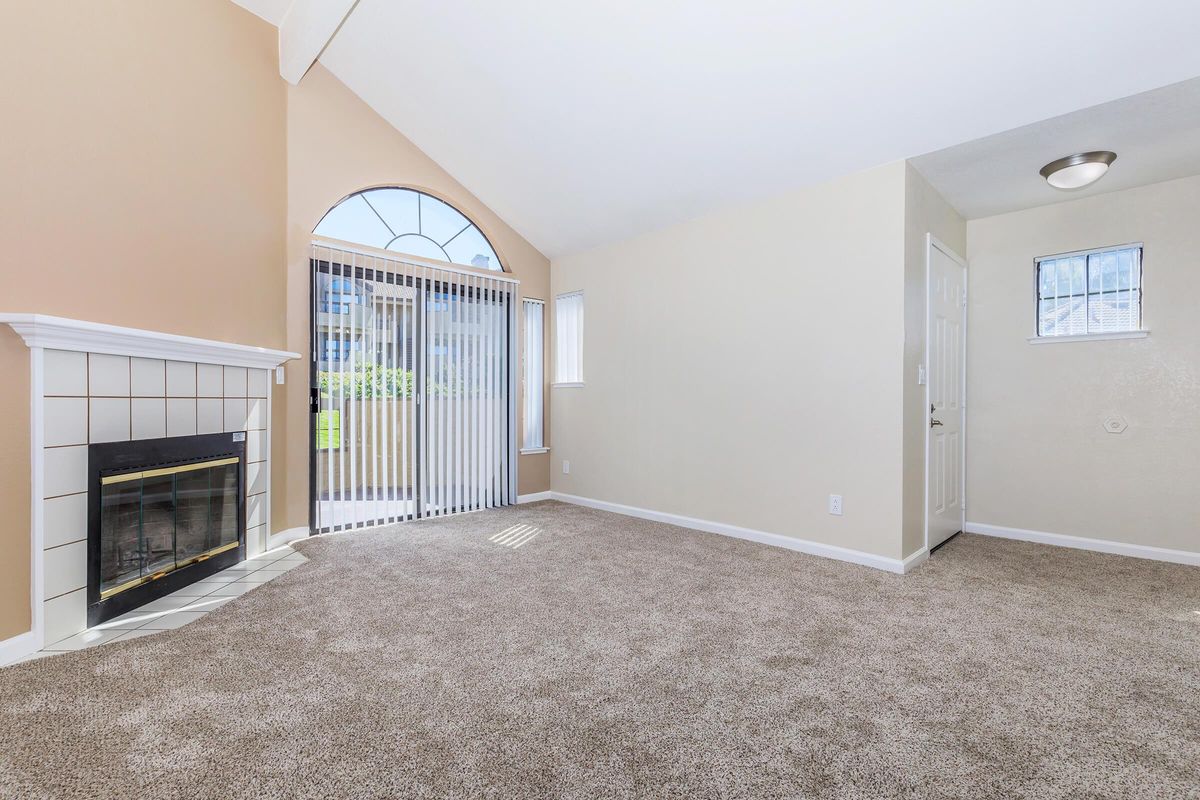 a living room filled with furniture and a flat screen tv