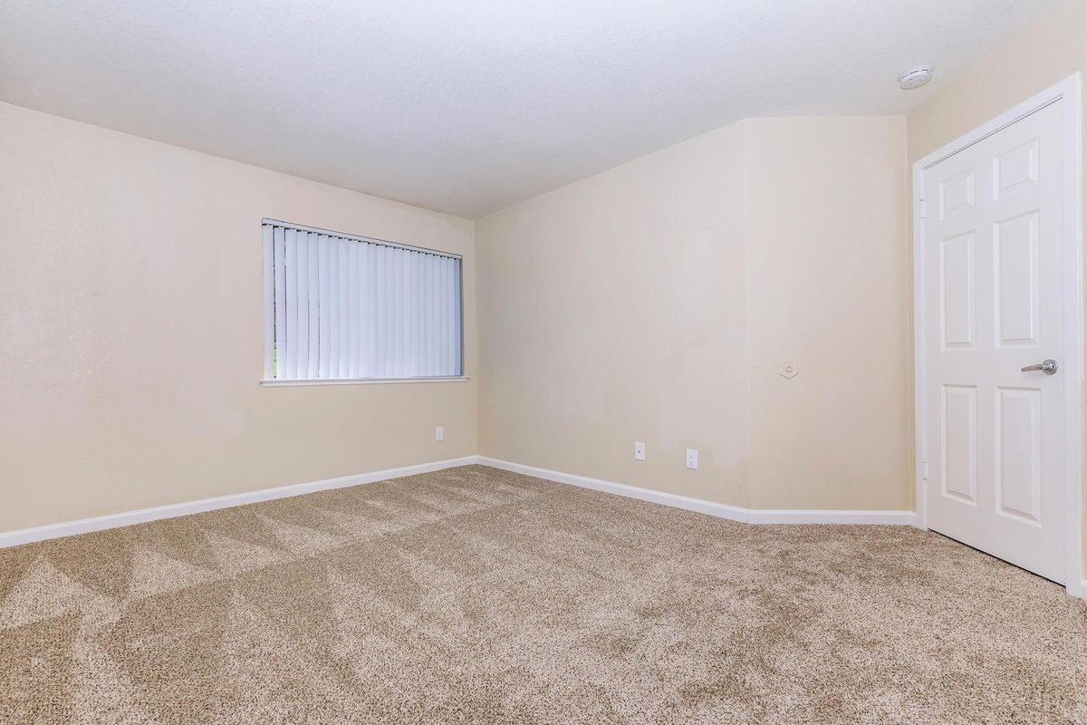 a bedroom with a large window