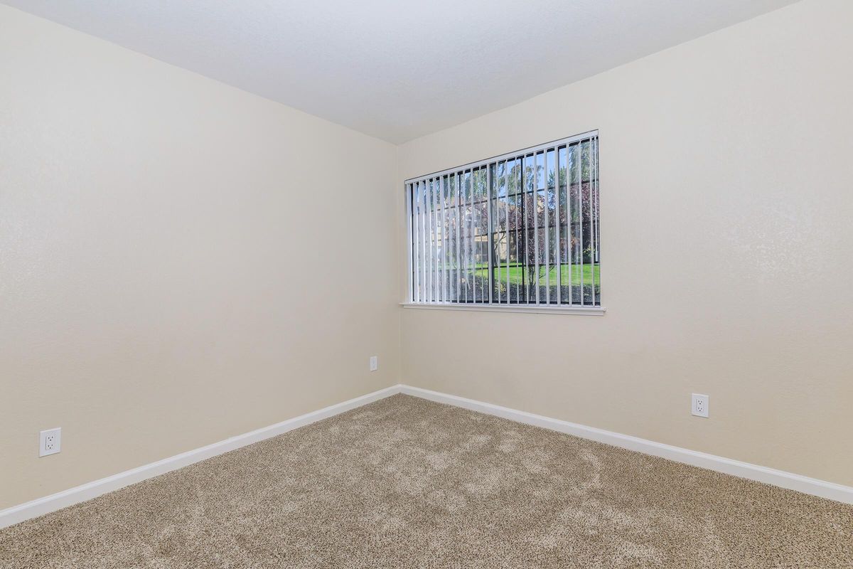 a bedroom with a large mirror