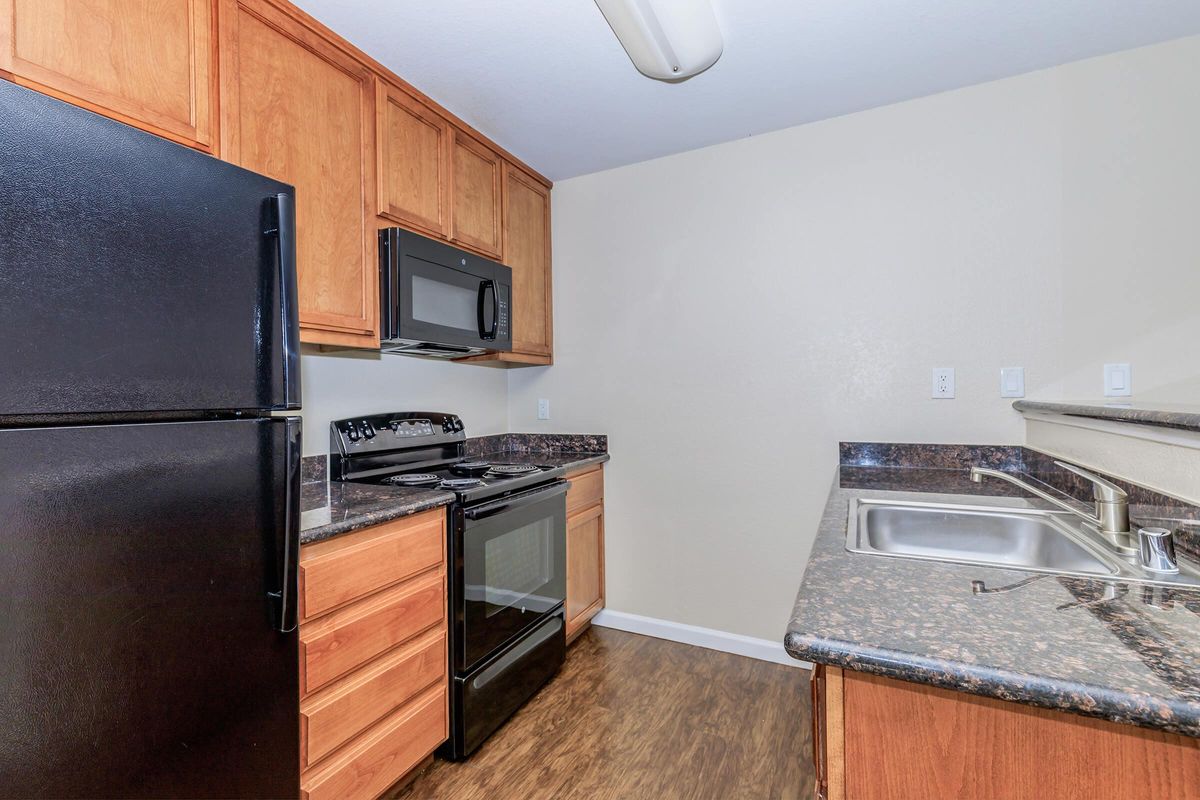 a kitchen with a stove top oven sitting inside of a refrigerator