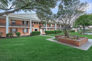 a large lawn in front of a building