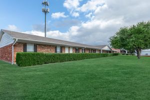 a large lawn in front of a house