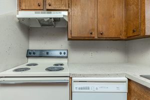 a microwave oven sitting on top of a stove