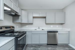 a kitchen with a stove top oven