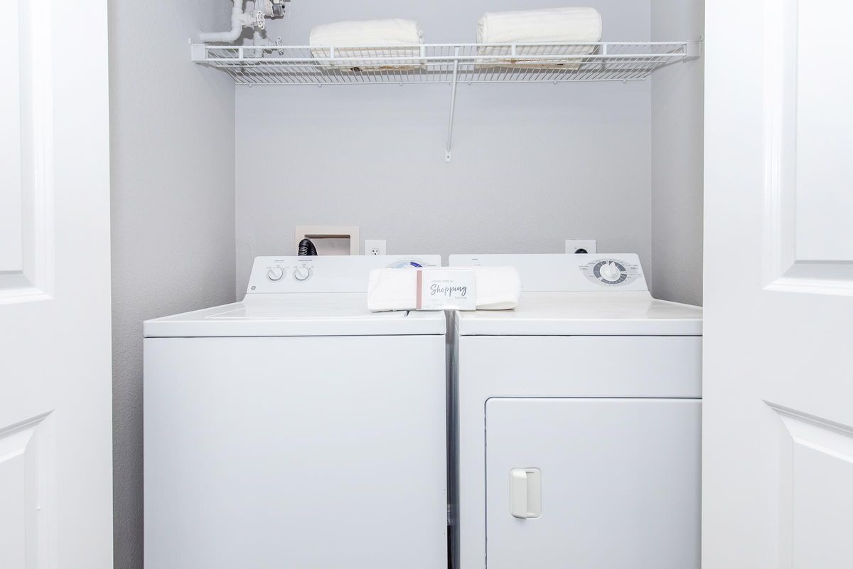 a kitchen with a sink and a refrigerator