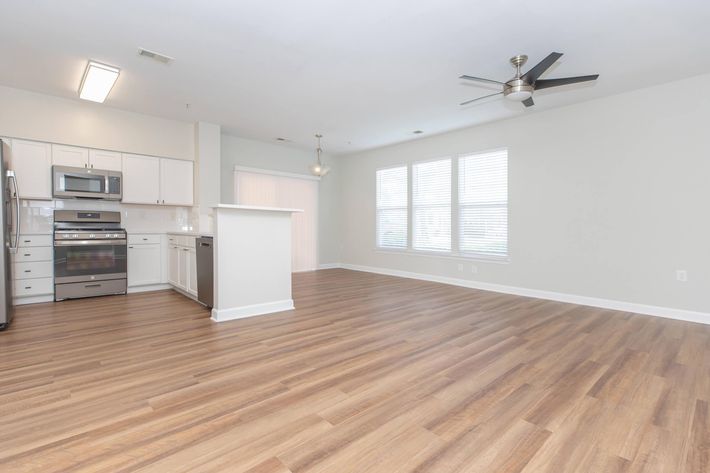 a kitchen with a wood floor