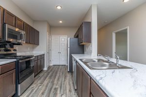 a large kitchen with stainless steel appliances