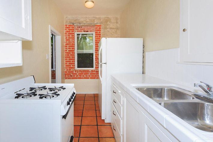 a kitchen with a stove and a sink