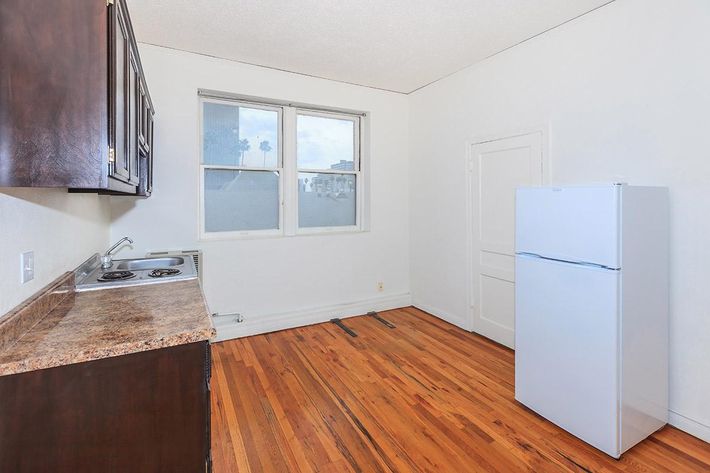 a kitchen with a wood floor