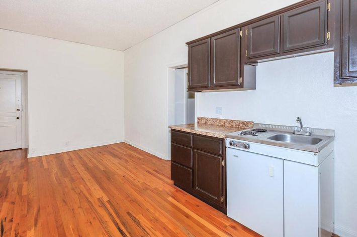 a kitchen with a stove and a refrigerator